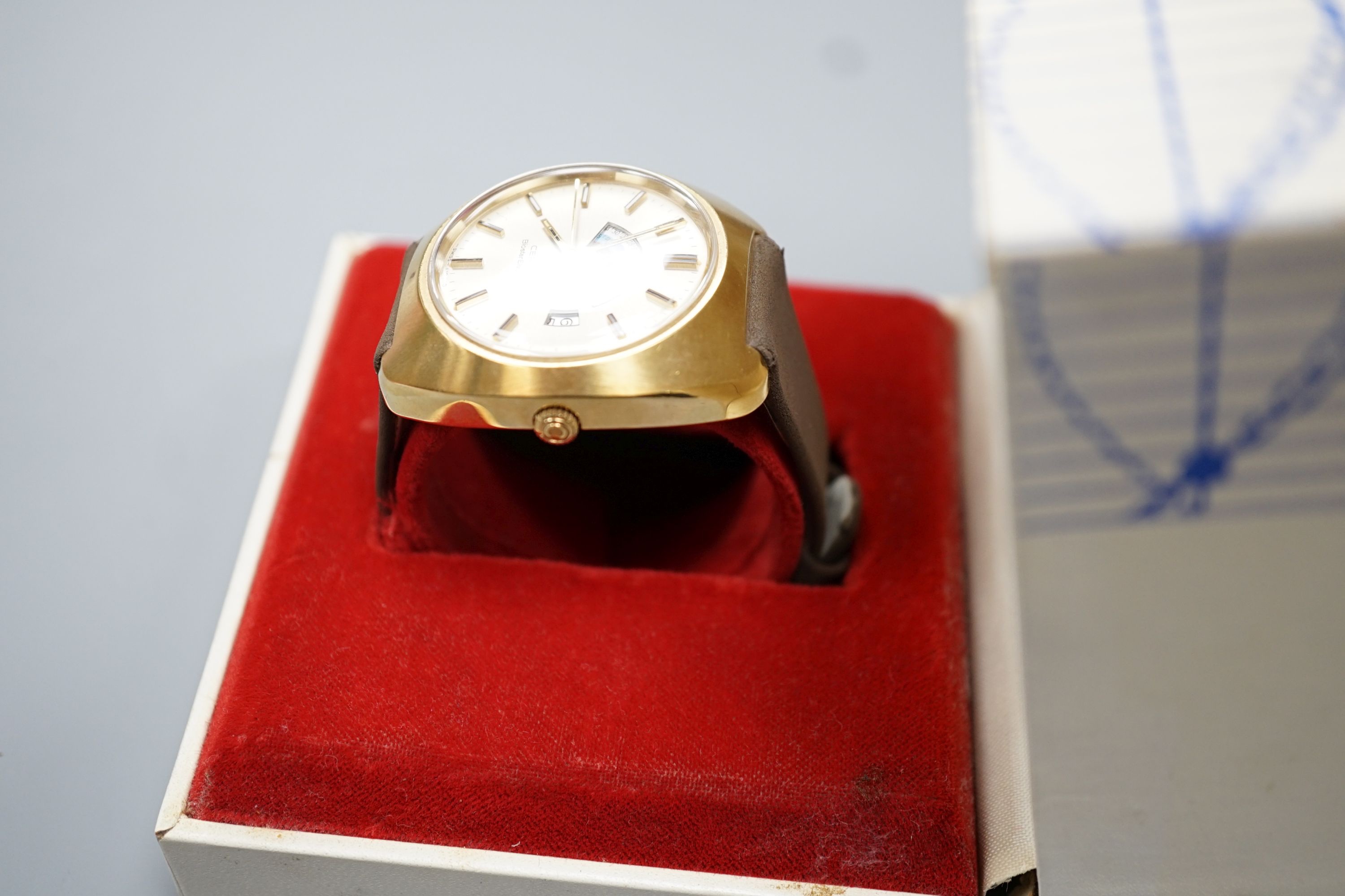 A gentleman's 1970's gilt and steel Certina Biostar Electrinic wrist watch, on Certina strap, case diameter 39mm, with Certina box.
